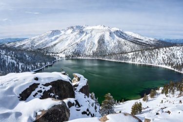 Snowy granite lookout overlooking emerald bay and Mount Tallac in winter
